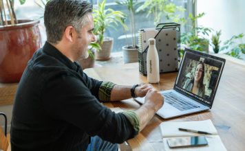 How to Avoid Scams on Free Webcam Sites: A Safety Guide man in black sweater using macbook pro
