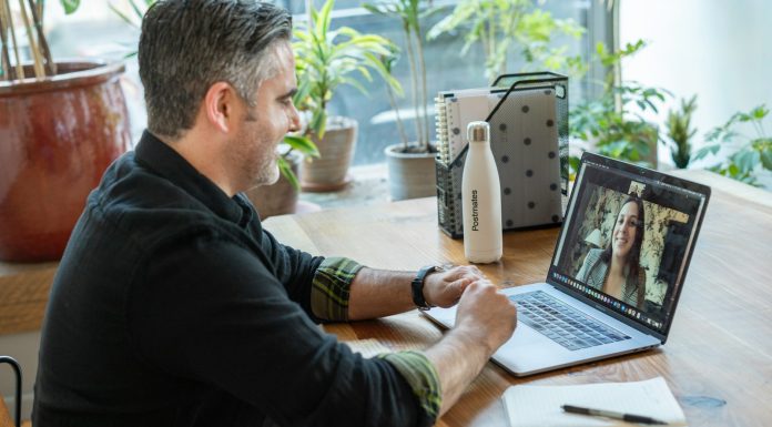 How to Avoid Scams on Free Webcam Sites: A Safety Guide man in black sweater using macbook pro