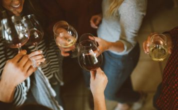 Zariah Aura to Host Industry-Only Birthday Bash in Hollywood group of people tossing wine glass