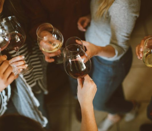 Zariah Aura to Host Industry-Only Birthday Bash in Hollywood group of people tossing wine glass