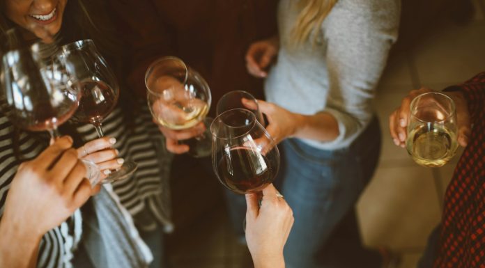 Zariah Aura to Host Industry-Only Birthday Bash in Hollywood group of people tossing wine glass